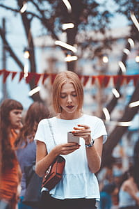 Close-Up Photo of Woman Using Phone thumbnail