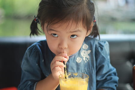 girl drinking mango juice thumbnail