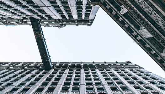 low-angle photography of grey high-rise building thumbnail