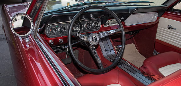 black vehicle steering wheel close-up photo thumbnail