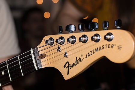 person playing Fender guitar thumbnail