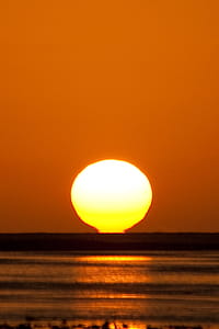 Hot Sunset Over Water Photo thumbnail