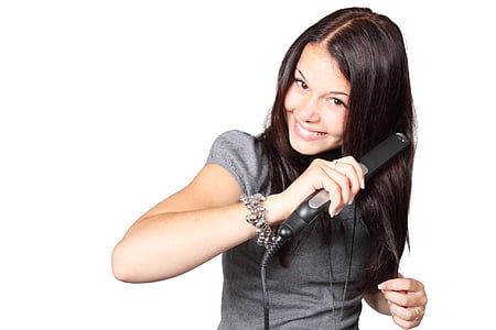 woman ironing her hair thumbnail