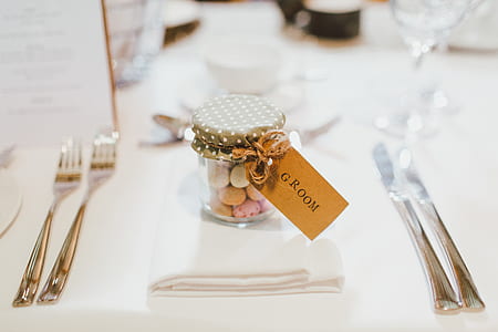 clear glass jar on white textile thumbnail