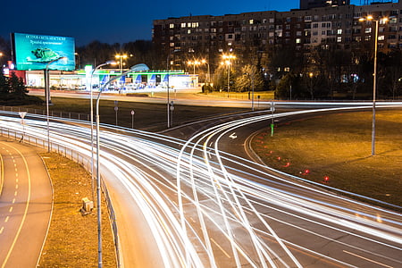 time lapse photography of moving cars on road thumbnail