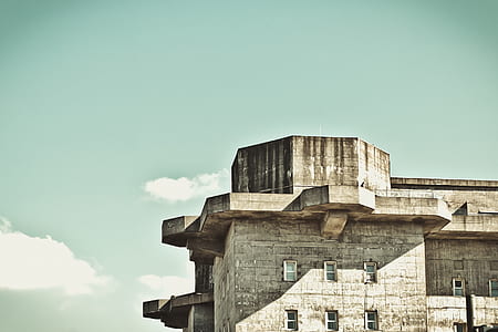 gray concrete building during day time thumbnail