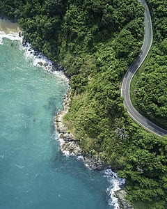 body of water beside road thumbnail