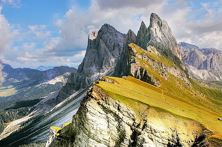 landscape photography of green and gray mountain under cumulus clouds thumbnail