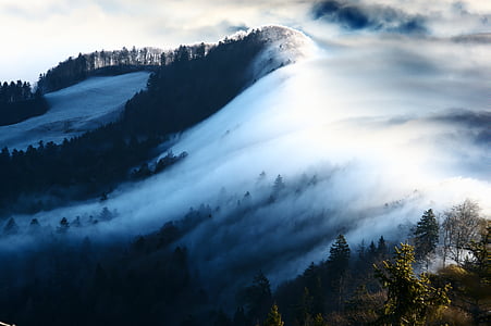 aerial photography of mountain covered with clouds during daytime thumbnail