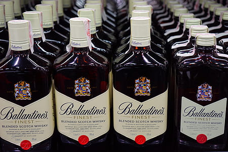 lined up Ballantines Finest Scotch Whiskey bottles thumbnail