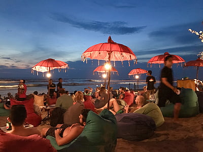 people gathering near ocean under blue sky thumbnail