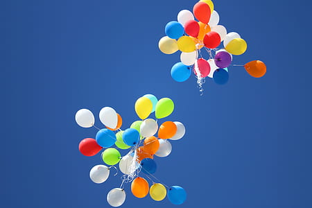 assorted-color balloons on the sky thumbnail