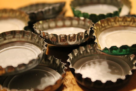 selective focus photo of pile of bottle lids thumbnail