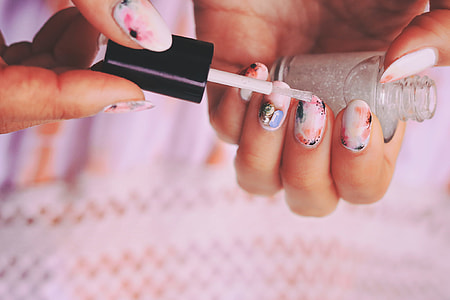 person using nail polish thumbnail