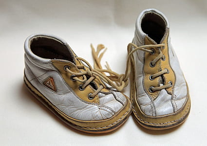 pair of white-and-brown leather lace-up shoes thumbnail