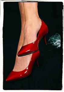 person wearing pair of red leather kitty heeled pointed-toe shoes thumbnail