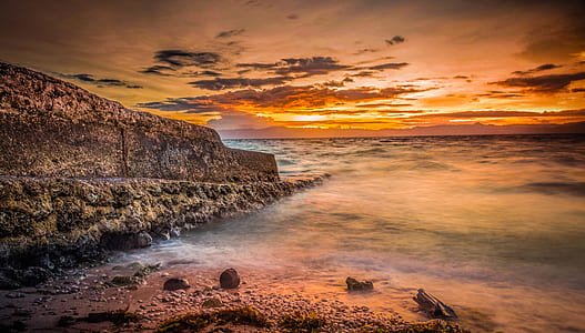 gray concrete dock under sunset thumbnail