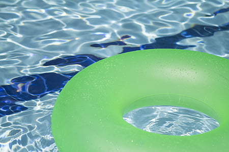 green pool floater in body of water thumbnail