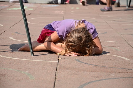 girl in purple shirt planking on floor thumbnail