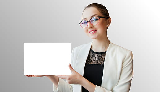 Photo of woman holding blank white sign in her hands thumbnail