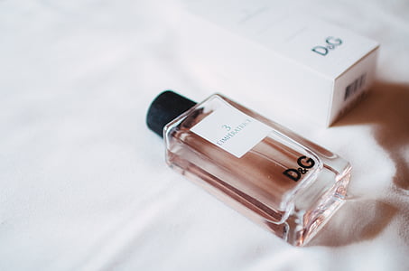 sealed Dolce & Gabanna fragrance bottle above white textile thumbnail