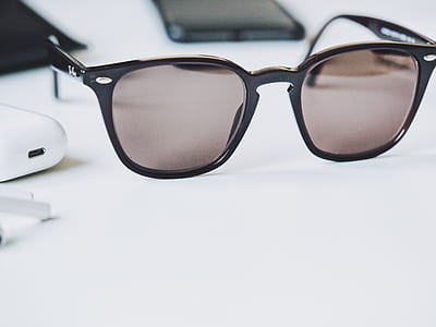 black sunglasses on table thumbnail