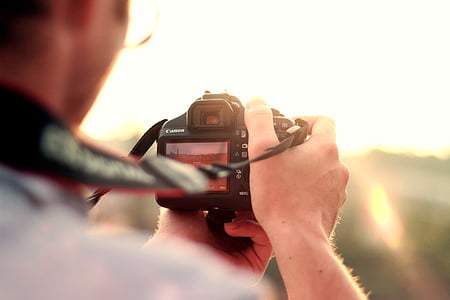 person taking photo outdoors thumbnail