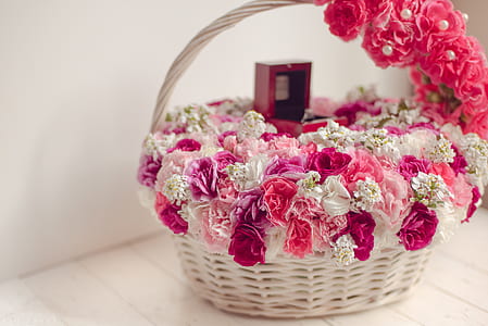 white and pink roses inside basket thumbnail