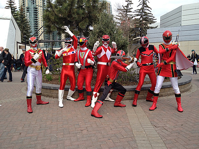 group of red power rangers gathered at cosplay event thumbnail