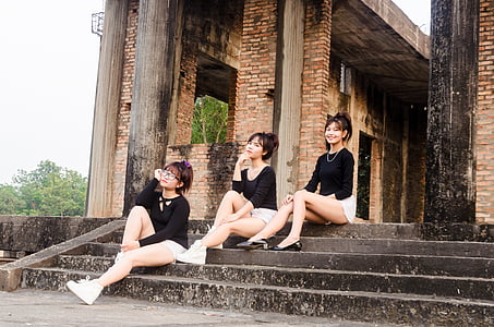 three woman sitting on stairs thumbnail