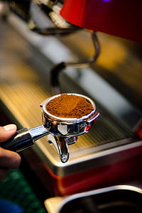 person holding coffee scoop thumbnail