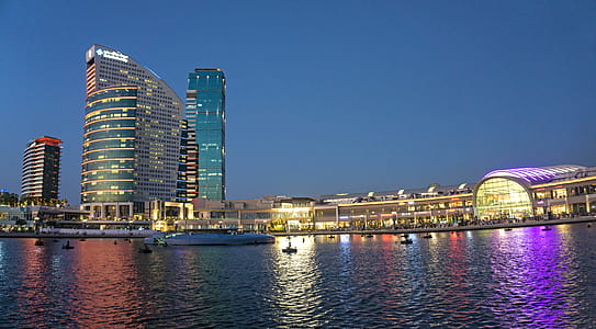 High-rise Building Near Body of Water during Night Time thumbnail