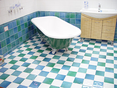 white and green freestanding bathtub near wall thumbnail