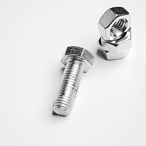 stainless steel threaded bolt and three hex nuts thumbnail