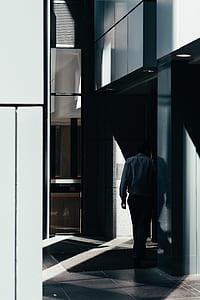 man walking inside a room thumbnail