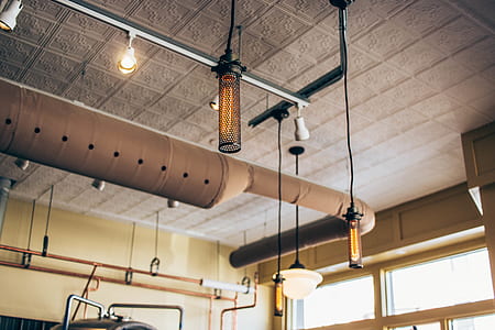 shallow focus photography of black and brown pendant lamps thumbnail