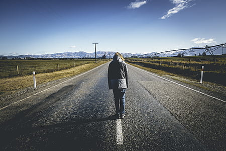 manwalking on asphalt road thumbnail