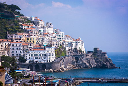 white concrete houses beside ocean thumbnail