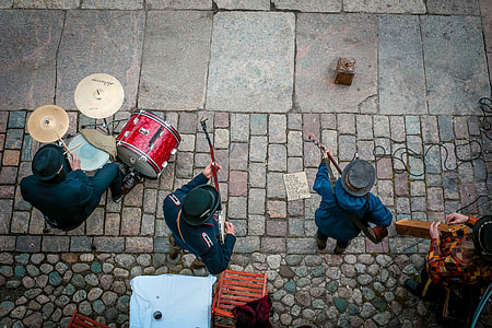 group of people playing instruments on sidewalk thumbnail