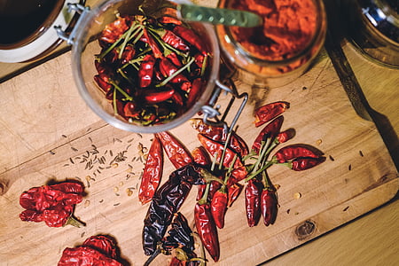 red chili on brown wooden table thumbnail