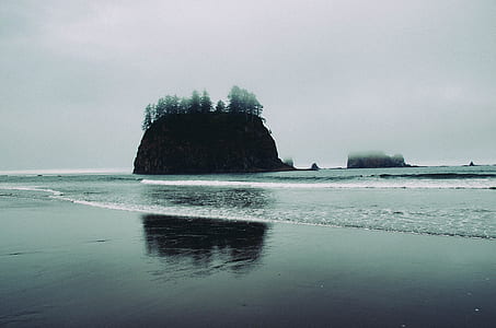 landscape photo of island from seashore thumbnail