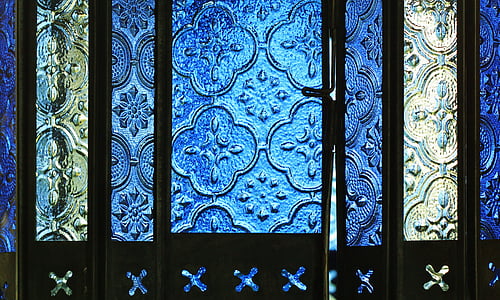 brown wooden blue and yellow glass doors closeup photo thumbnail