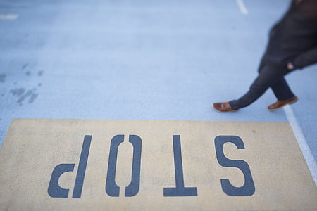 person waling on gray floor thumbnail