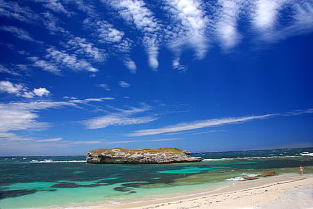 islet under blue sky and white clouds thumbnail