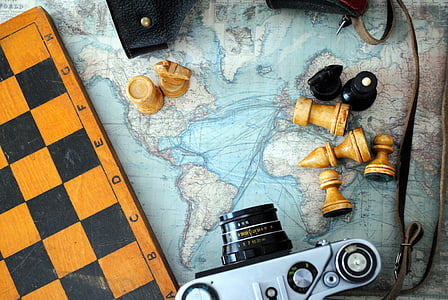 SLR camera near chess board thumbnail