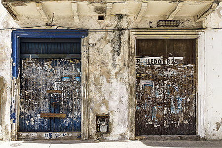 two brown and blue wooden doors thumbnail