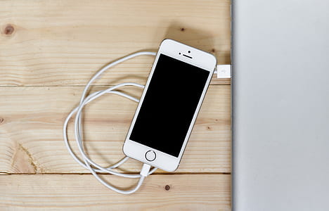 silver iPhone 5S on brown surface thumbnail