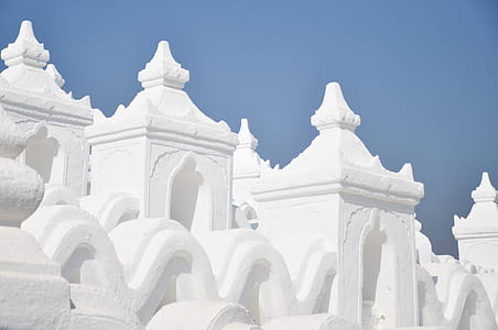 white concrete building under blue sky during daytime thumbnail