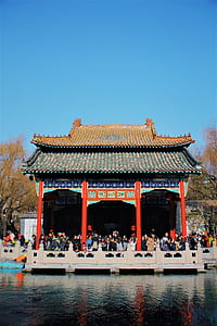 people standing in front of body of water thumbnail