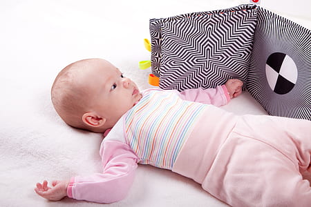 baby lying on bed thumbnail
